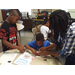 kids getting hands on instructions to make Alabama Brown Bear treat