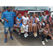 group image of kids sitting on firetruck