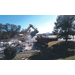 bulldozer and dumptruck cleaning up tornado debris