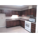 kitchen with gas range and upper and lower cabinets